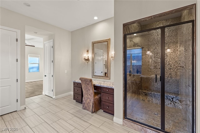 10179 Emerald Sunset Ct, Las Vegas, NV 89148 - bathroom with a stall shower, vanity, baseboards, and tile patterned floors