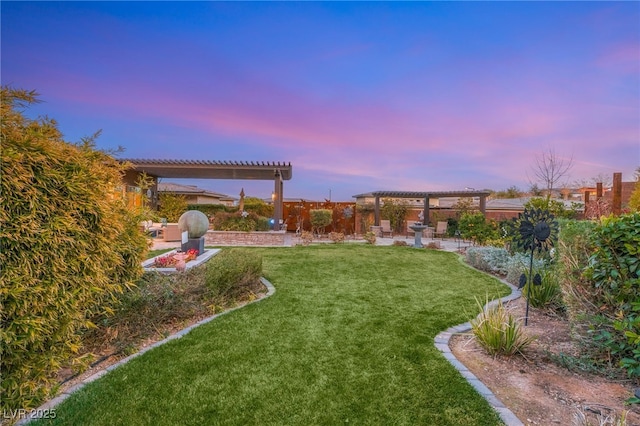 yard at dusk with a pergola and a patio