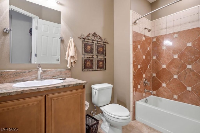 full bathroom featuring vanity, toilet, and tiled shower / bath