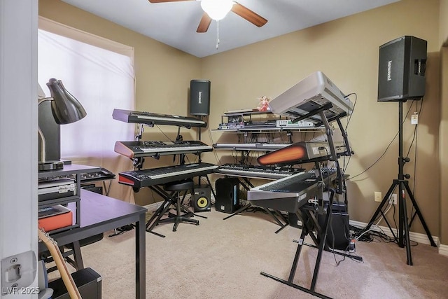 miscellaneous room with ceiling fan and light colored carpet