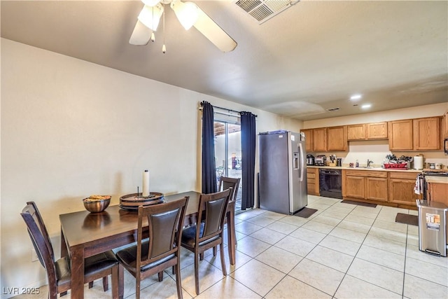 kitchen with sink, black appliances, ceiling fan, and light tile patterned flooring