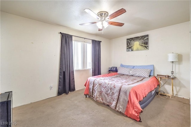 bedroom with light carpet and ceiling fan