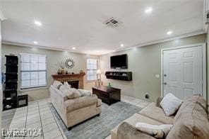 tiled living room featuring ornamental molding