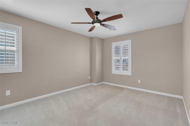 carpeted empty room featuring ceiling fan