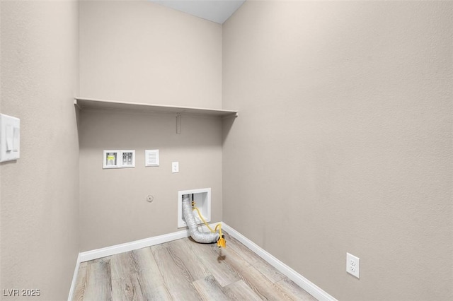 laundry area featuring hookup for a gas dryer, hookup for a washing machine, and light wood-type flooring