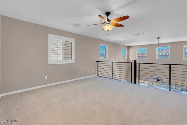 carpeted empty room with ceiling fan