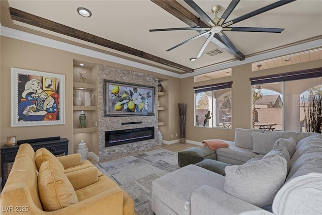 living room with crown molding, built in features, and ceiling fan