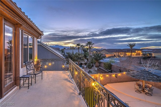 view of balcony at dusk