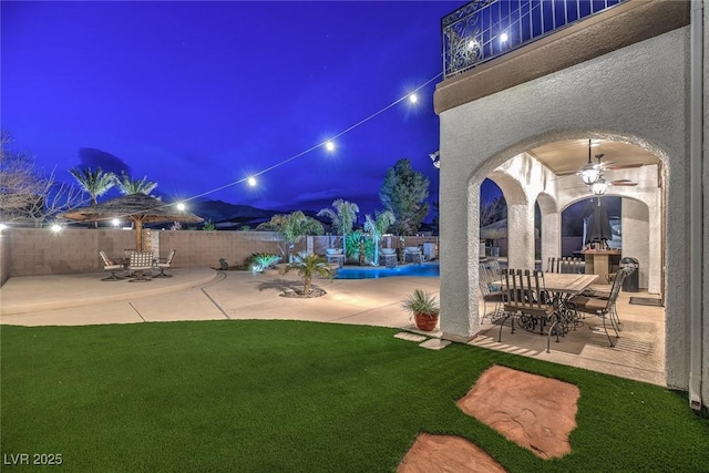 exterior space featuring ceiling fan and a patio