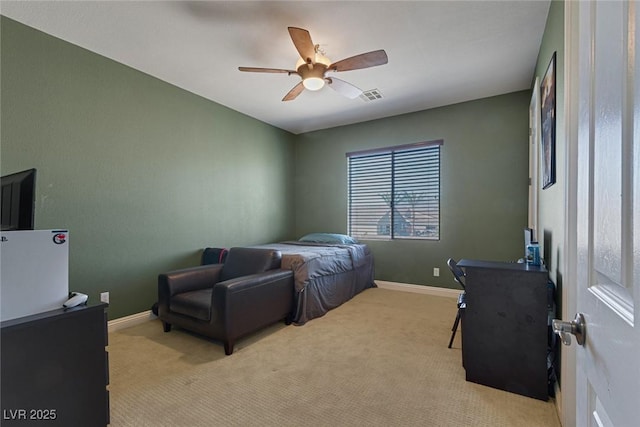 bedroom with ceiling fan and light colored carpet