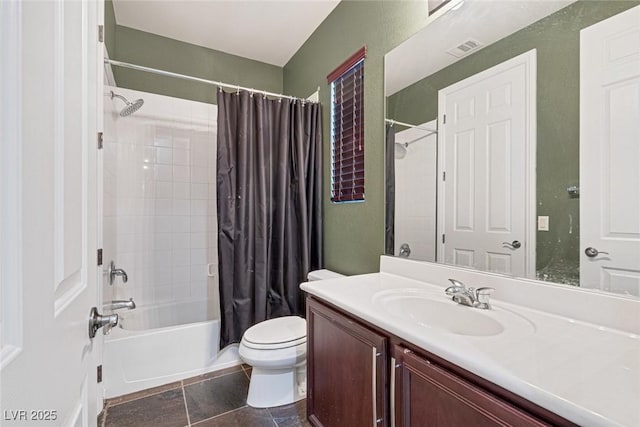 full bathroom featuring vanity, shower / bath combo with shower curtain, and toilet