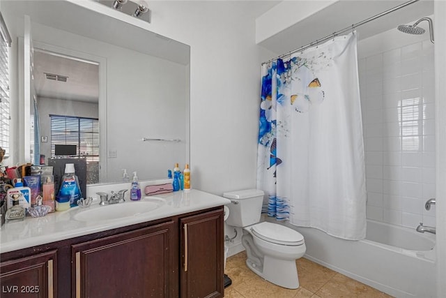 full bathroom with vanity, toilet, tile patterned flooring, and shower / bath combo