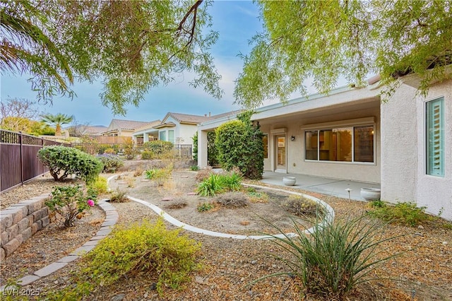 rear view of house with a patio