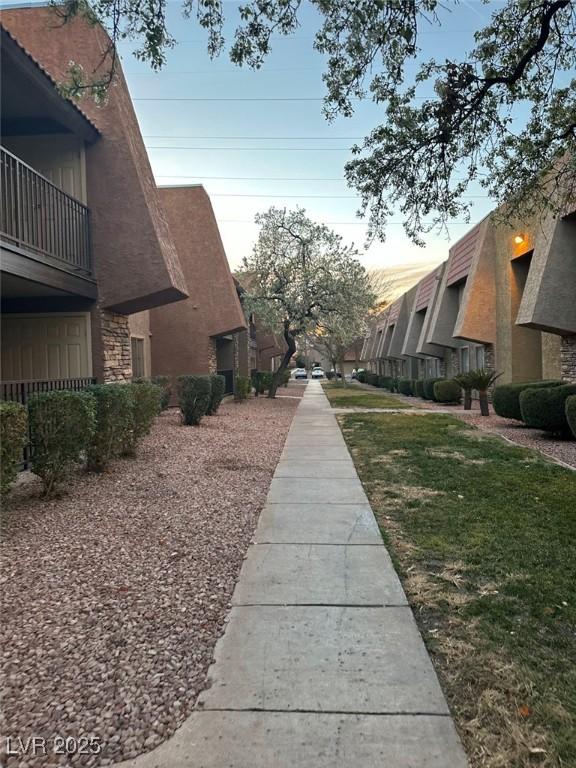 view of home's community with a lawn