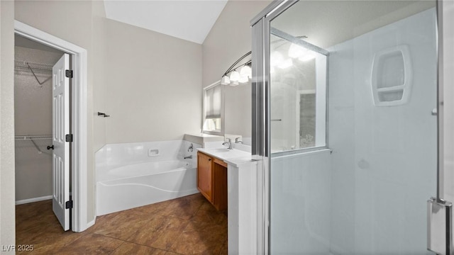 bathroom featuring vanity and separate shower and tub