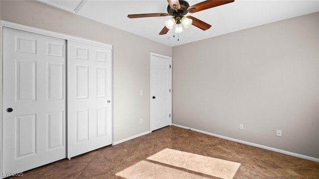 unfurnished bedroom with tile patterned flooring, a closet, and ceiling fan