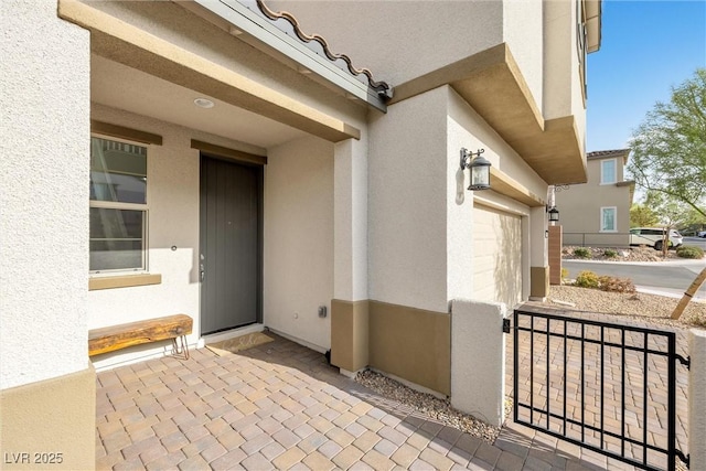 entrance to property featuring a garage