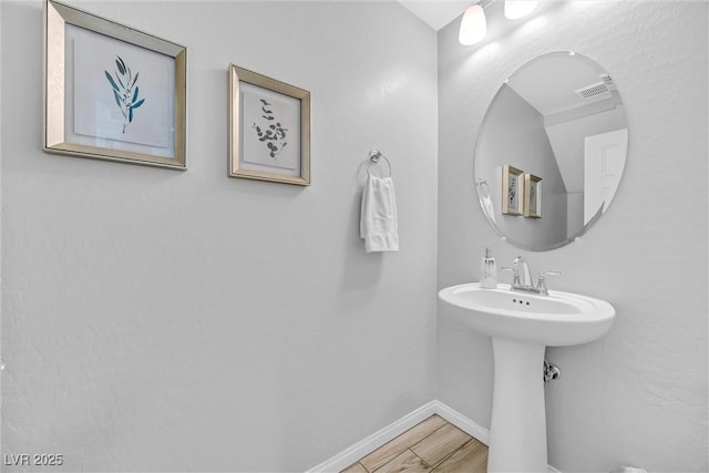 bathroom featuring sink and hardwood / wood-style flooring