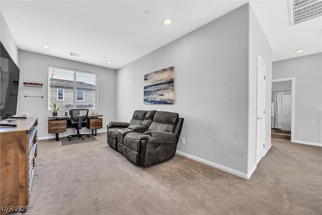 living room featuring light carpet