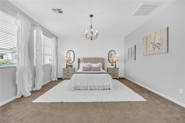 bedroom with an inviting chandelier and carpet flooring