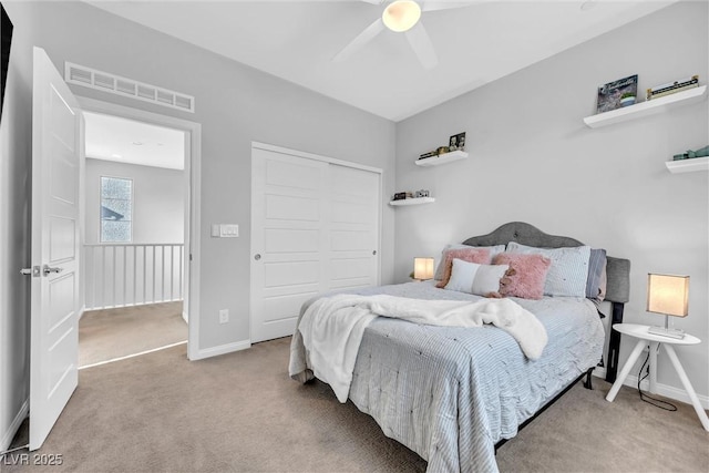 bedroom with carpet floors, a closet, and ceiling fan