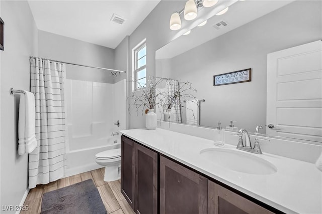 full bathroom with vanity, toilet, and shower / bath combo