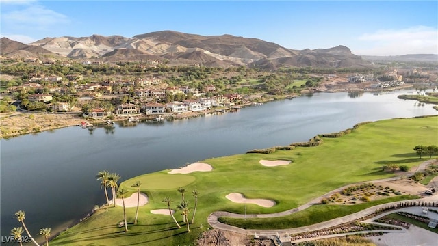 aerial view featuring a water and mountain view