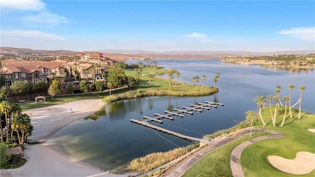 aerial view featuring a water and mountain view