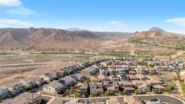 birds eye view of property featuring a mountain view