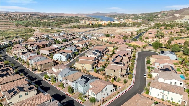 birds eye view of property with a mountain view