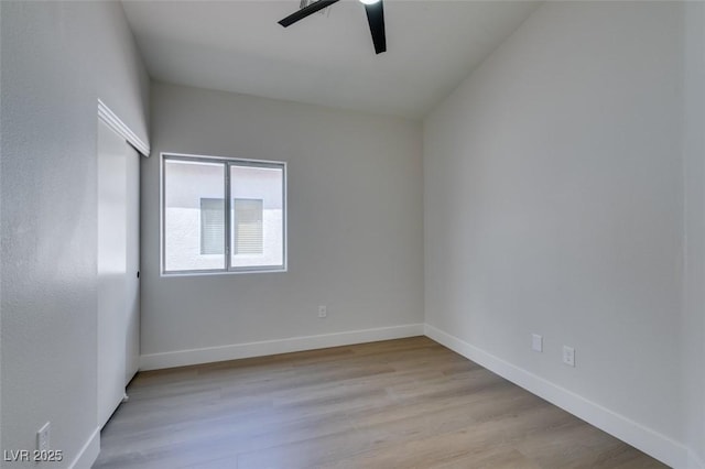 spare room featuring ceiling fan and light hardwood / wood-style floors