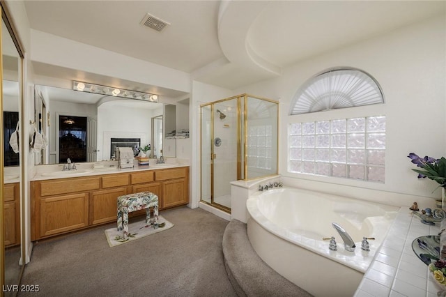 bathroom with vanity and plus walk in shower