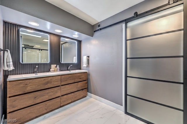 bathroom with vanity and a shower with shower door