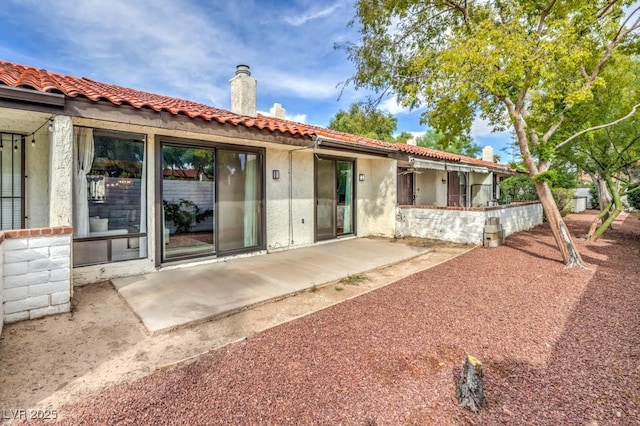 rear view of house featuring a patio area