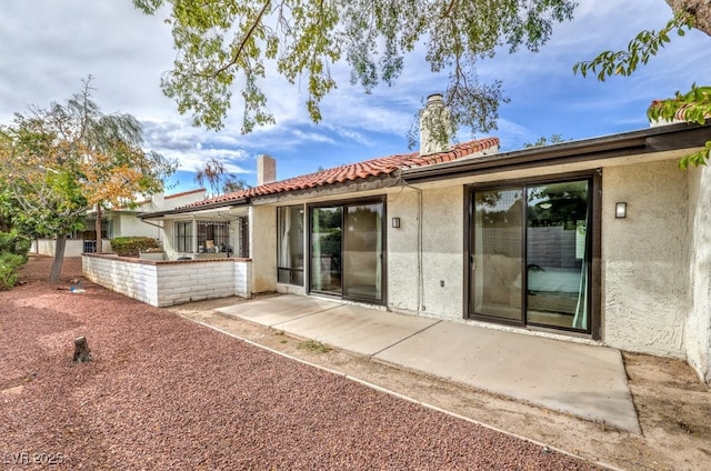 rear view of property with a patio area