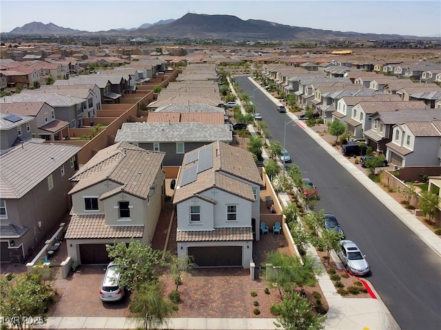 birds eye view of property featuring a mountain view