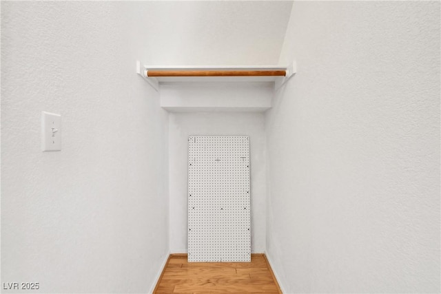 spacious closet featuring light wood-type flooring