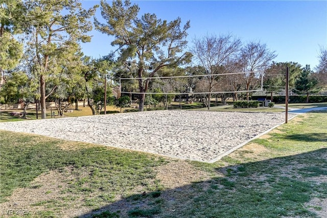 view of property's community with a yard and volleyball court