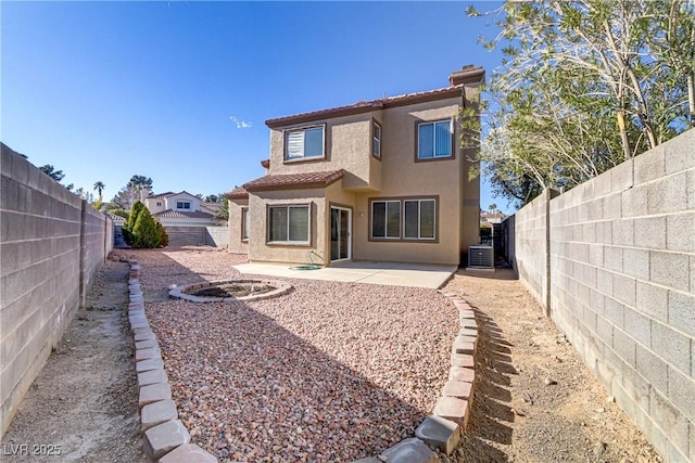 rear view of house with a patio