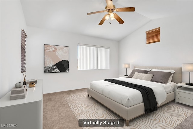 bedroom featuring light carpet, lofted ceiling, and ceiling fan