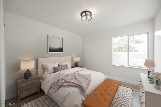 bedroom with hardwood / wood-style flooring