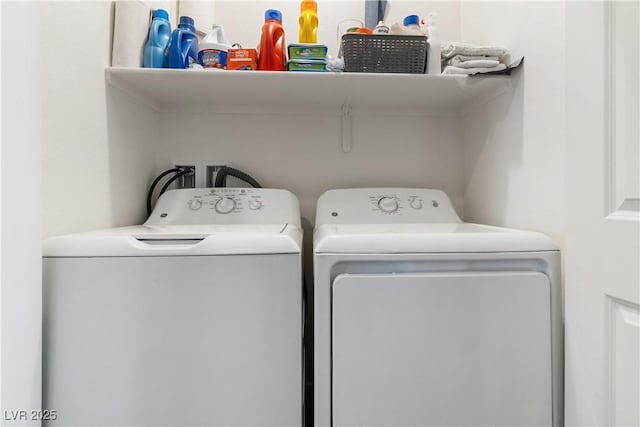 laundry room with independent washer and dryer