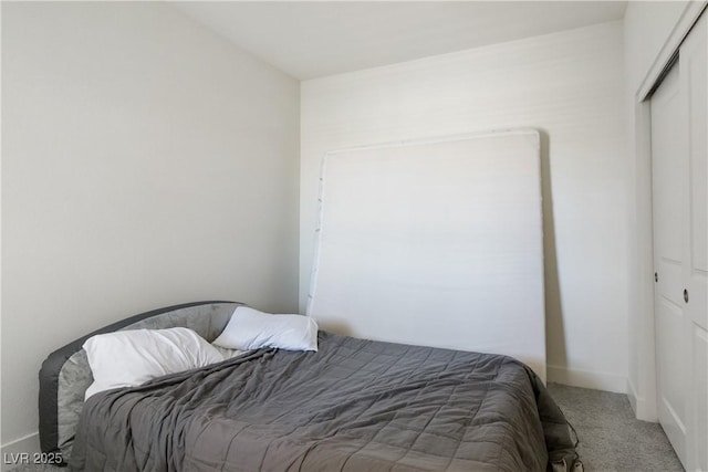 carpeted bedroom with a closet