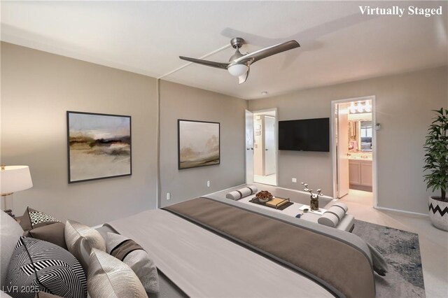 bedroom with baseboards, a ceiling fan, and connected bathroom
