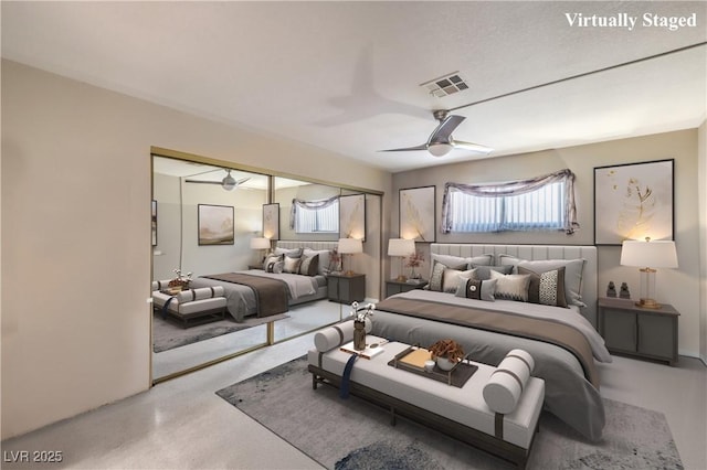 bedroom with visible vents, a ceiling fan, and a closet