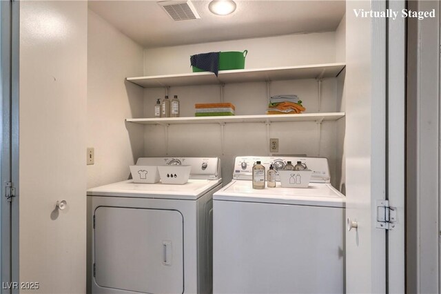laundry area with laundry area, separate washer and dryer, and visible vents