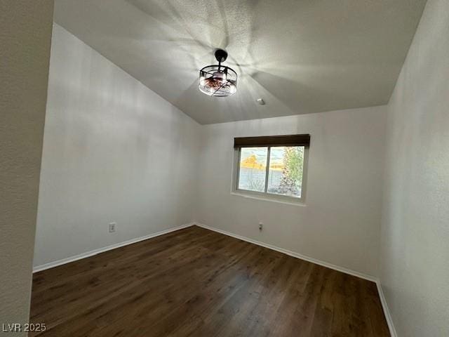 unfurnished room featuring dark wood-type flooring