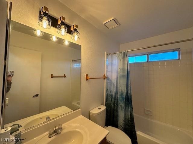 full bathroom with vanity, toilet, and shower / bath combo with shower curtain