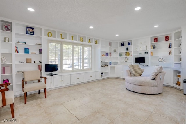 sitting room featuring a textured ceiling