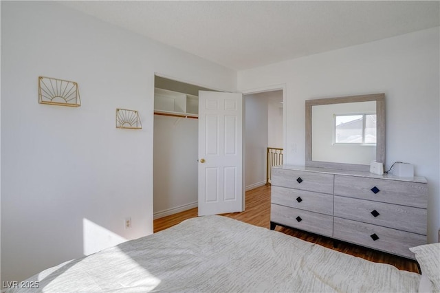 bedroom featuring hardwood / wood-style flooring and a closet